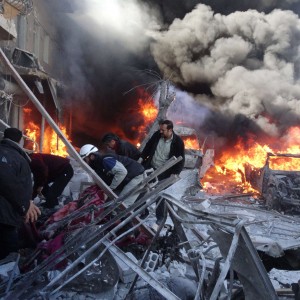 Medical personnel look for survivors following a reported airstrike on the Tariq al-Bab district of the northern Syrian city of Aleppo on February 1, 2014. Syrian government and opposition delegations leave 10 days of peace talks with few results and a follow-up meeting uncertain, but analysts and negotiators say the discussions are an important beginning.  (AFP PHOTO/Mohammed Al-khatieb)