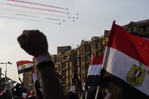Planes in formation paint the skies with the national tri-colours to roars of approval from the crowds. (GIANLUIGI GUERCIA / AFP)