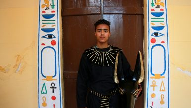 Man dressed like Anubis without mask