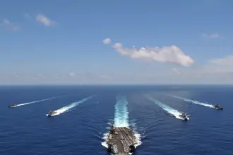 Iran warns of 'total war' as US carrier strike group nears Middle East