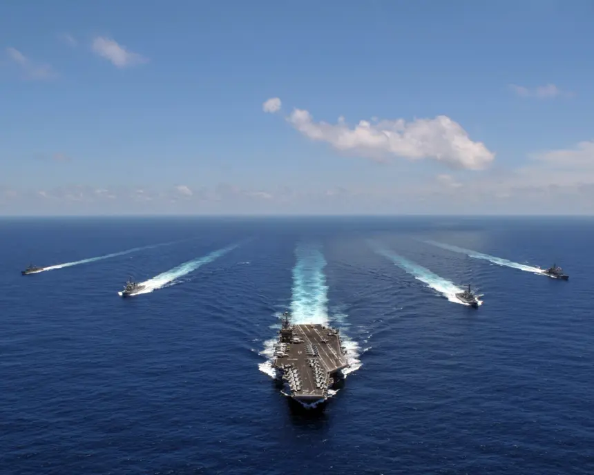 Iran warns of 'total war' as US carrier strike group nears Middle East