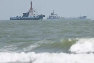 Oman and Iran plan temporary Hormuz shipping corridor as Trump declares waterway cleared of mines