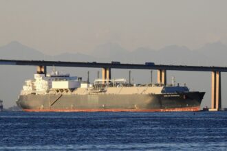 LNG tanker carrying Qatari cargo struck in Strait of Hormuz as Mideast conflict drives oil rally